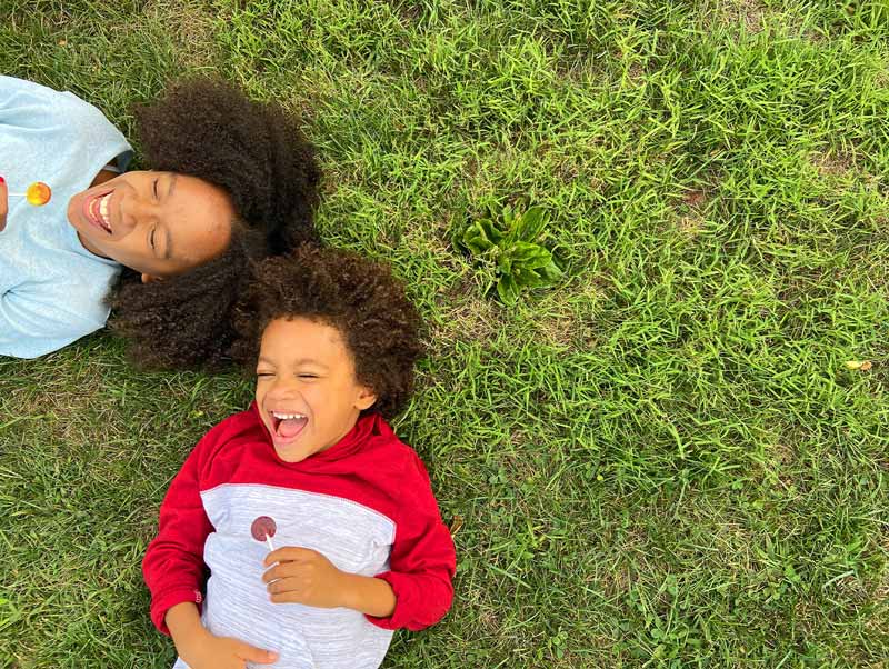 Kids enjoying YumEarth outdoors